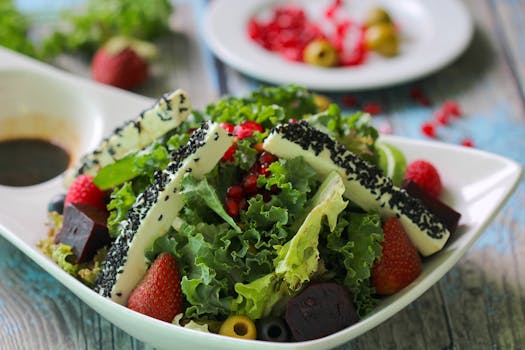 colorful seasonal salad with strawberries and spinach